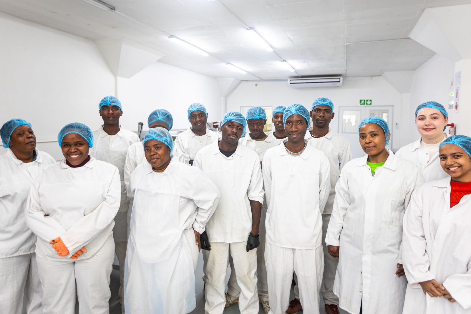 The Trident Nutrition production team in whites and hairnets