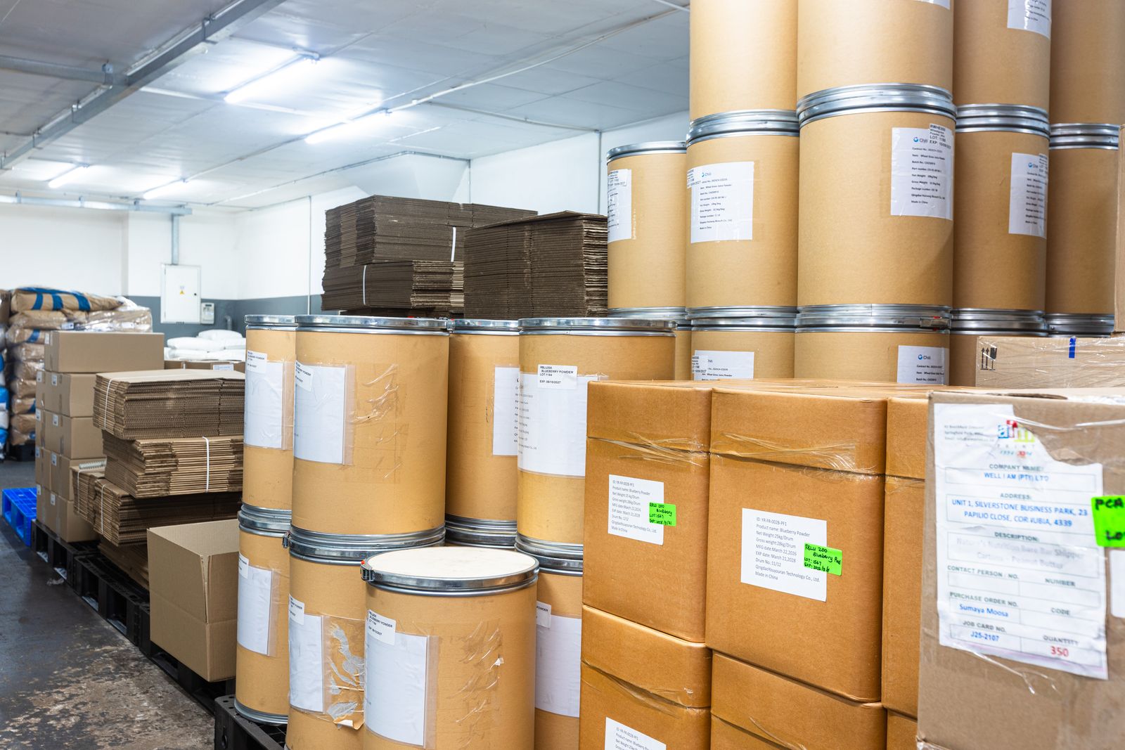 Raw material drums and packaging stock in the Trident Nutrition store